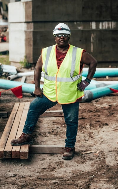 Coworker posing at a construction site.