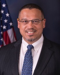 Headshot of Keith Ellison in front of the American flag
