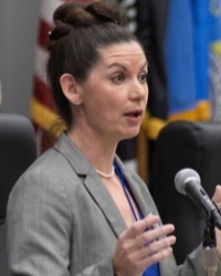Headshot of Kate Luthner giving a speech
