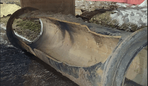 A large, damaged water main pipe