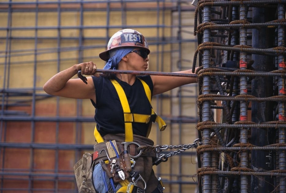 Construction worker working on building infrastructure. 