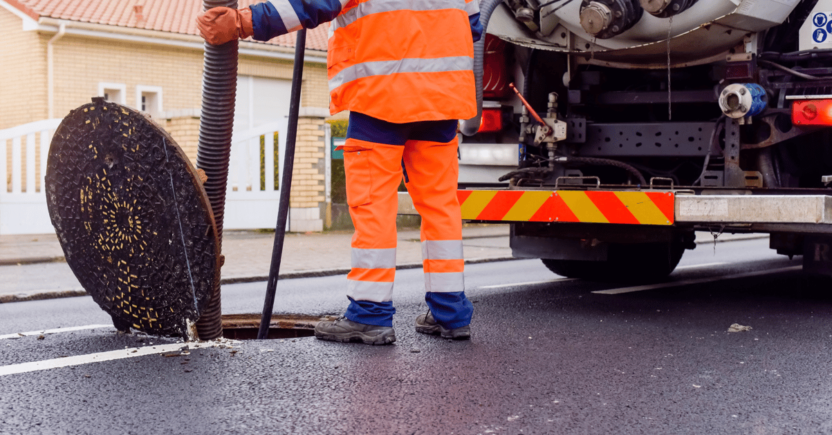 Laborer maintaining a sewer