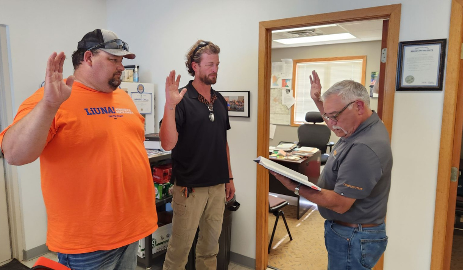 Jim Hall and Lorne Lundeen being sworn in by Dan Olson, LIUNA International Representative