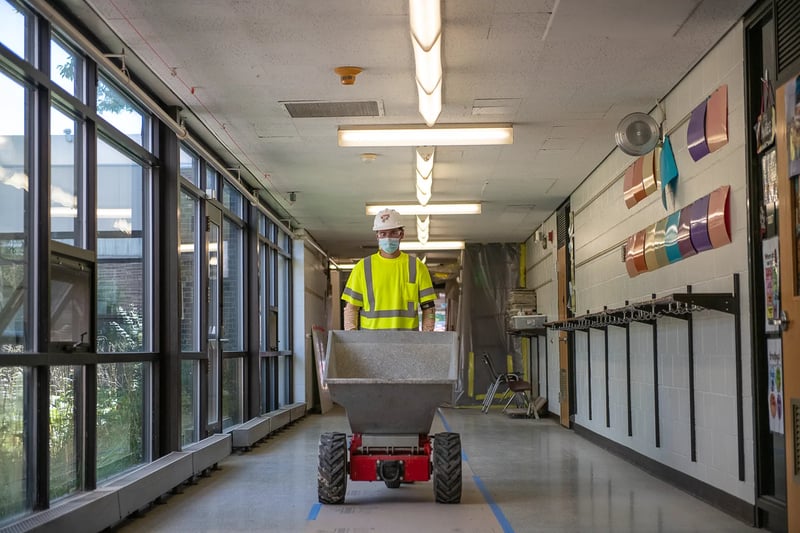 Construction worker rolling equipment