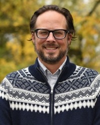Headshot of Reed Olson